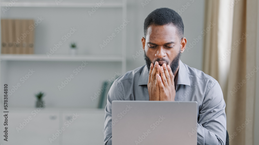 Depressed african businessman frustrated after reading bad news upset man having problem, feels desperate by business failure sitting at office desk. Student got email with failed test exam results Depressed african businessman frustrated after reading bad news upset man having problem, feels desperate by business failure sitting at office desk. Student got email with failed test exam results