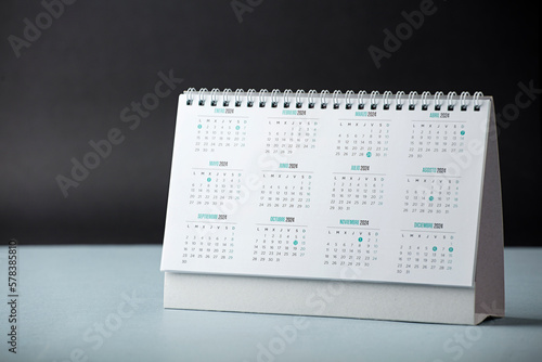 table calendar with year 2024 and days, with black background on the desk