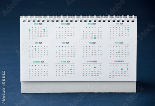 desk calendar with year 2024 and days, blue desk