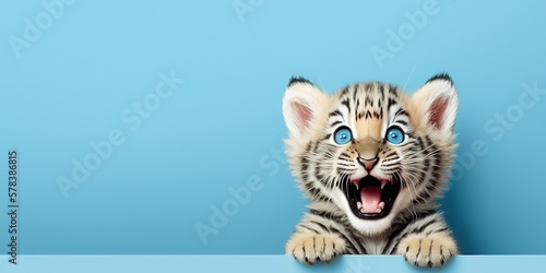 cute adorable tiger cub smiling on blue background and copy space generative ai photo