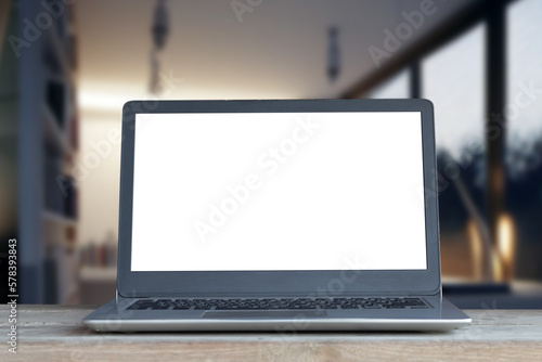 Wallpaper Mural Laptop computer on desk at office or co-working space, Laptop with white blank on screen and blurred background , working space concept. Torontodigital.ca