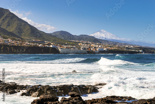 Coast of Punta del Hidalgo in Tenerife with the coastal town of Bajamar and Mount Teide in the background.