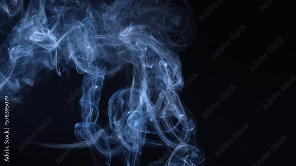 Puffs of smoke on a black background. Close-up Puffs of smoke on a black background. Close-up