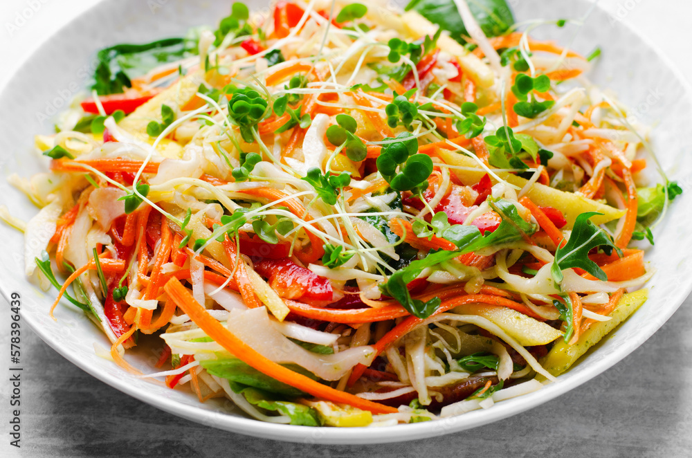 Fresh Vegetable Salad with Cabbage, Bell Pepper, and Carrot on Bright Background, Healthy Eating