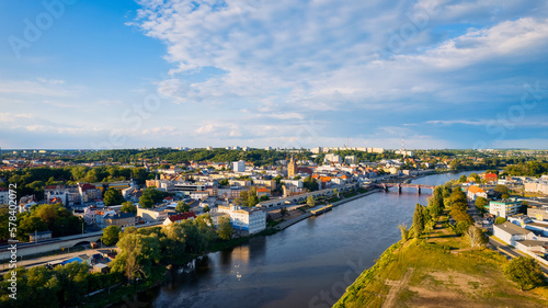 In Gorzów Wielkopolski, a drone photo was taken on a sunny day featuring the River Warta, the Cathedral, and the city center