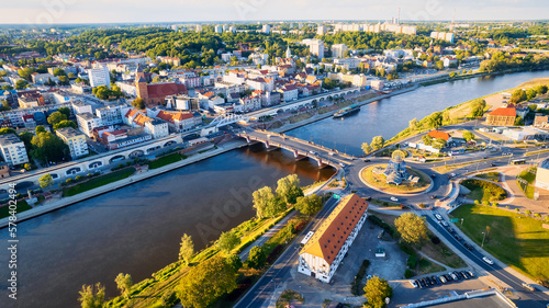 A beautiful drone photo was taken on a sunny day in Gorzów Wielkopolski, capturing the River Warta, the Cathedral, and the city center