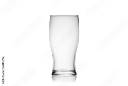 Empty beer glass isolated, without glare. Reflection on the surface. Back light.	
