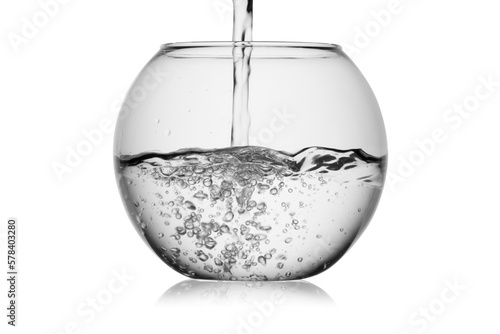 Foto Splash jet of water pours in glass fishbowl with bubbles isolated, without glare