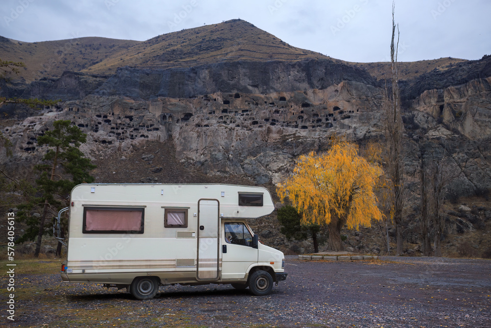 motorhome with yellow tree in autumn