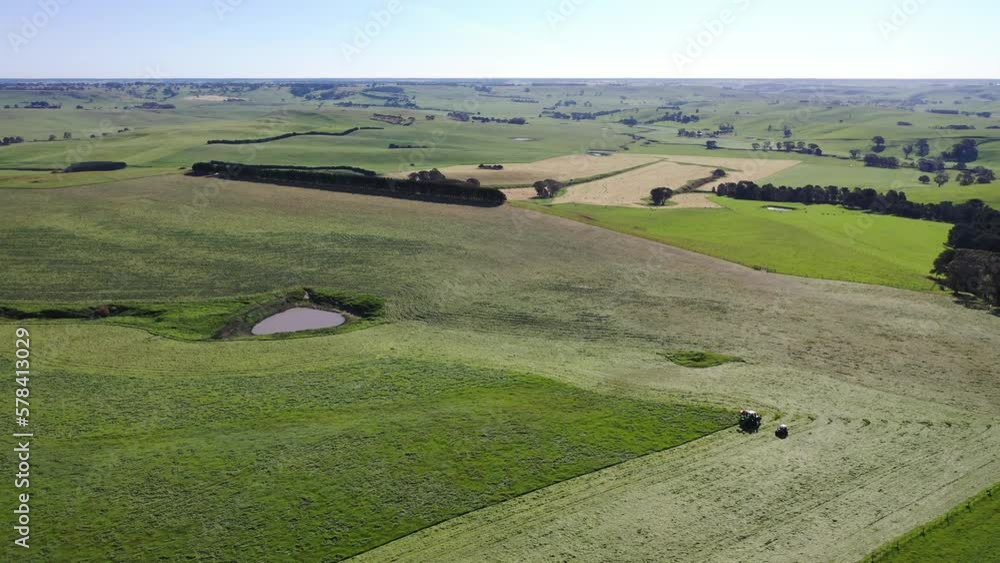 Harvest time on the farm. Time lapse of Harvesting silage and hay in a field. Baling and wrapping hay for live stock feed Harvest time on the farm. Time lapse of Harvesting silage and hay in a field. Baling and wrapping hay for live stock feed