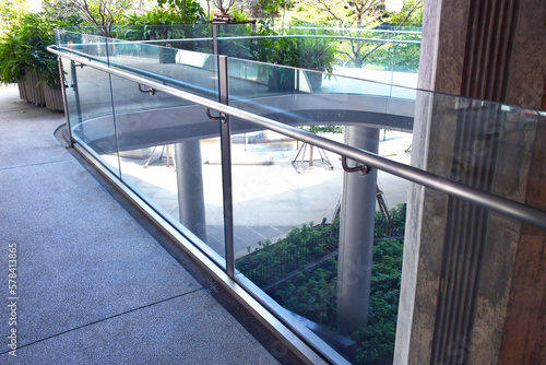 Curve tempered laminated glass railing balustrade panels frame less  safety glass for modern architectural buildings. Concept for Aluminum balcony or terrace design with glazing profile. 