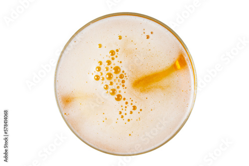 Beer in glass. Beer foam with bubble. View from above.