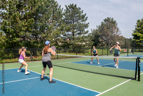 Pickleball Players in Action at Net