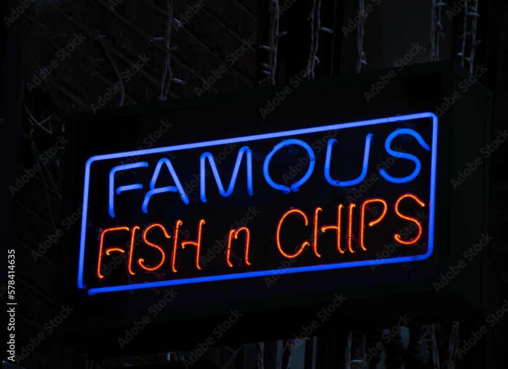 neon sign on fish and chip shop