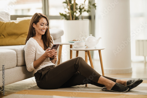 Woman Texting On Smartphone At Home