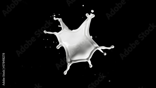 Round milk splash isolated on black background.