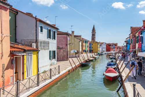 Burano, Italy with colorful painted houses along canal with boats © Photocreo Bednarek