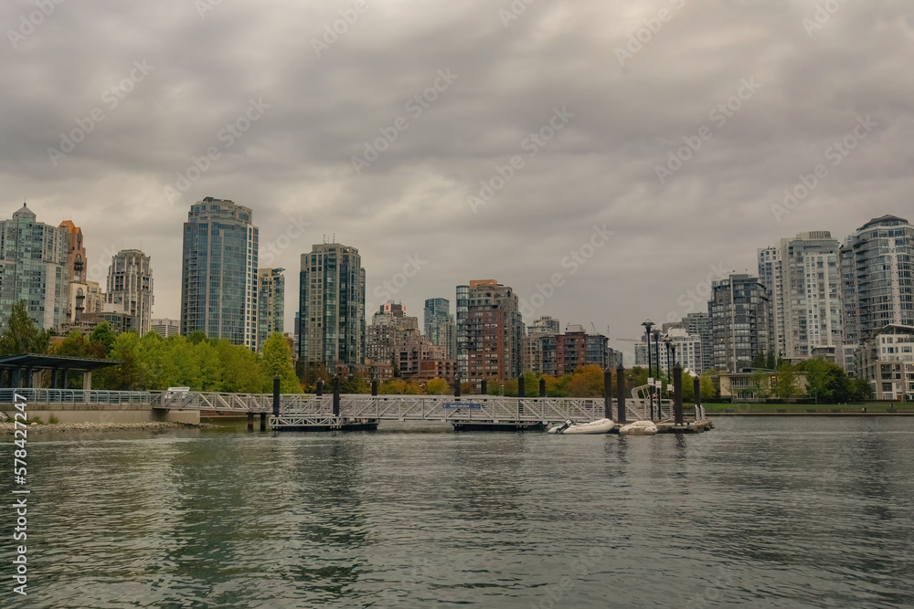 Granville island marina and traditional boats with False Creek writing in Vancouver downtown Canada