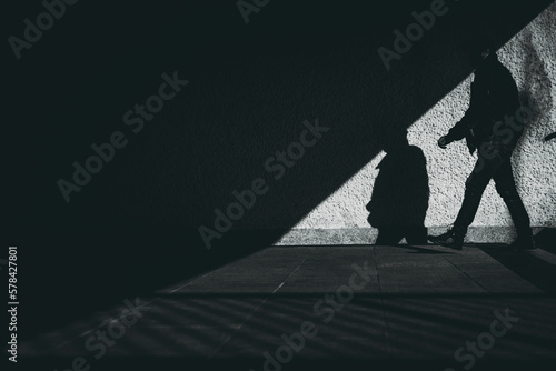 Fotografija silhouette of a man in the underground passage