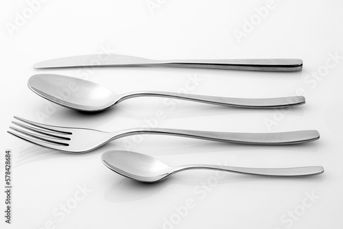 Isolated cutlery on a glossy white background