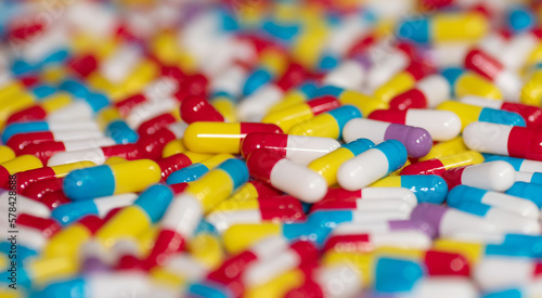 Different pills on beige background, flat lay. 