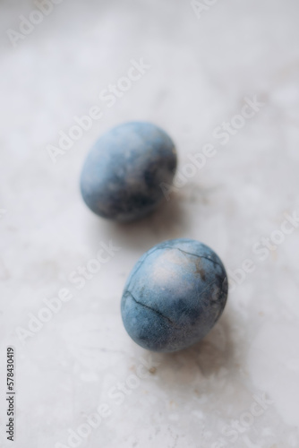 Sprigs Painted Easter eggs and on a linen tablecloth, marble eggs. Eco.Trend. Copy space