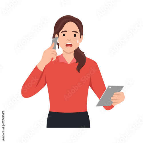 Shocked young woman talking on the smart phone or mobile phone scared in shock with a surprise face. Amazed frowning female calling holding tablet