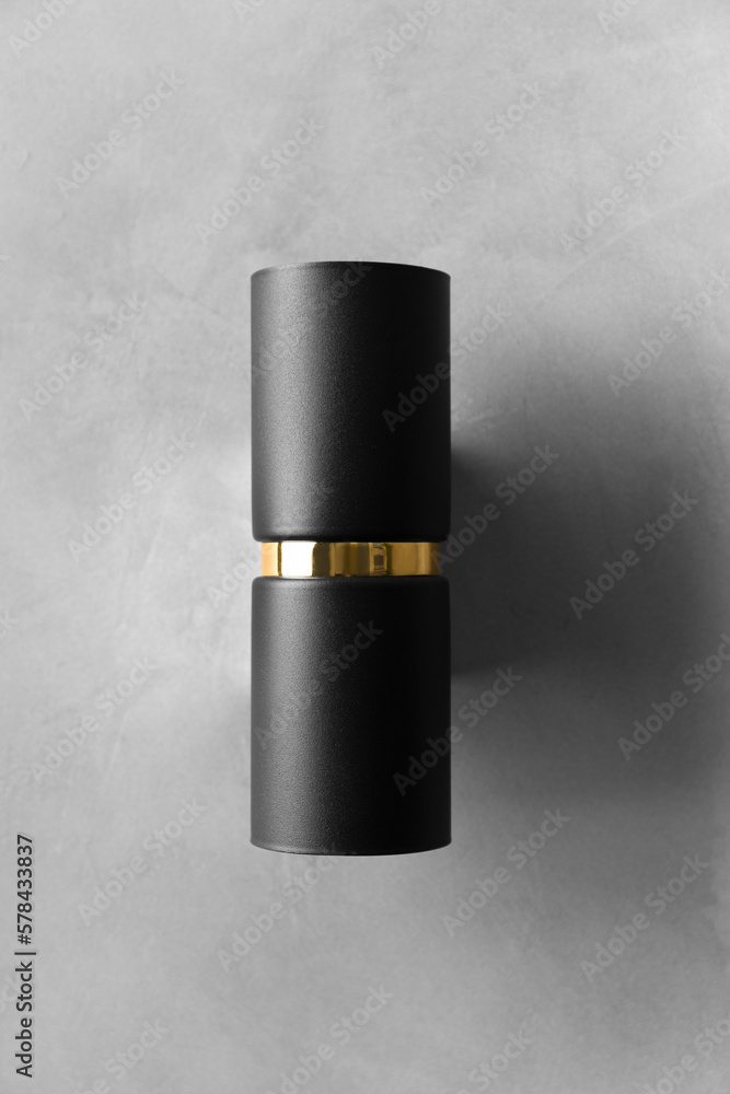 black wall lamp on gray wall copy space black wall lamp on gray wall copy space