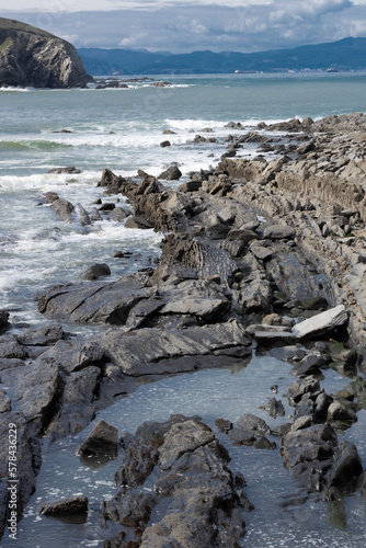 Beautiful vertical image of rocks in the sea