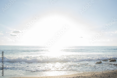 Bright blinding sun by the sea. Seascape background