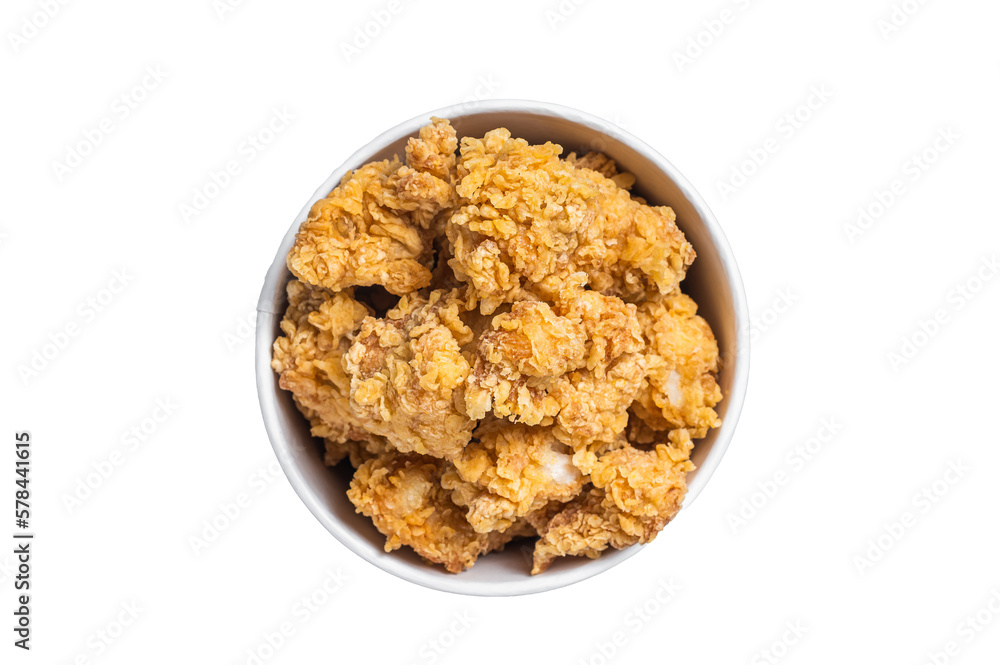 Crunchy chicken popcorn bites in a basket from fastfood.  Isolated, transparent background