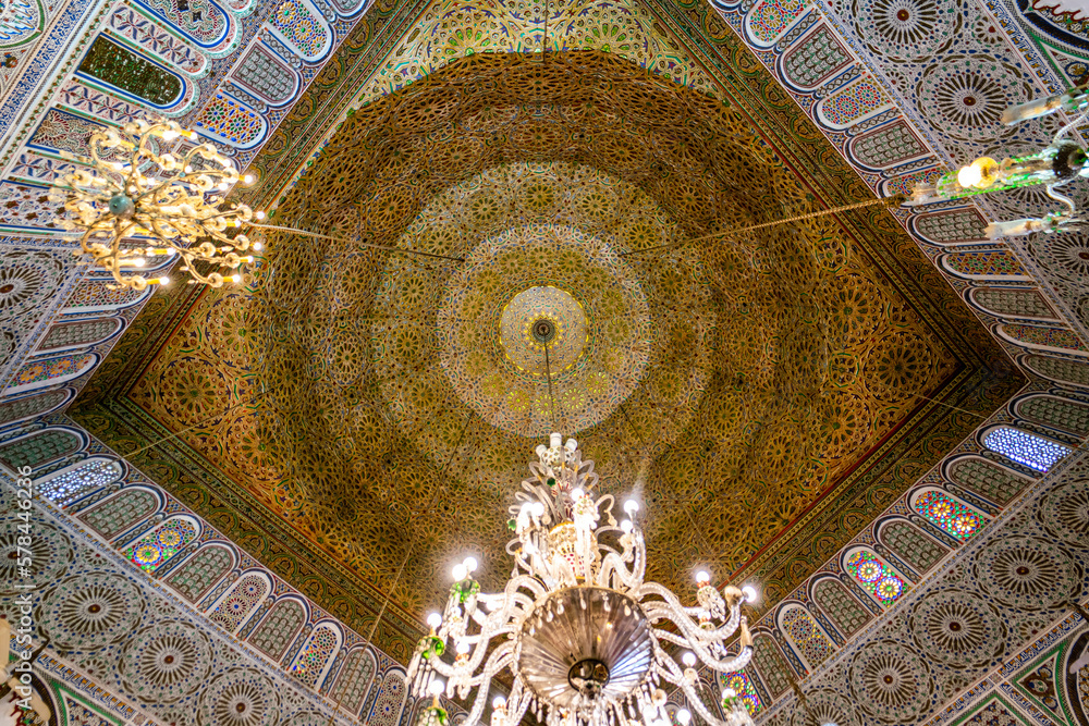 Beautiful wooden ceiling with a chandelier at Zawiya of Moulay Idris II in the medina of Fez, Morocco