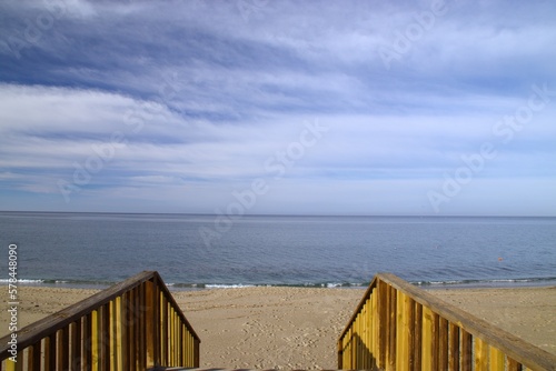 escalera madera acceso al mar photo