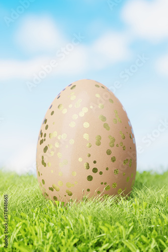 Brown Easter egg with a pattern in gold circles in a meadow in the grass. 3d render.