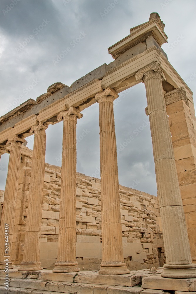 The Erechtheion (Temple of Athena Polias) an ancient Greek Ionic temple-telesterion on the north side of the Acropolis during cloudy winter day