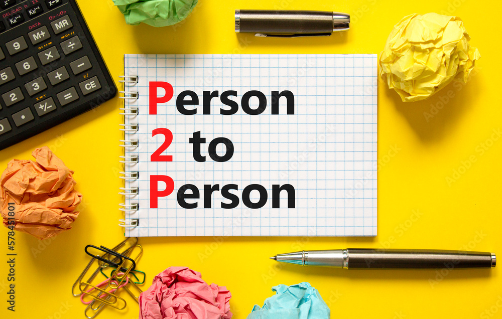 P2P person to person symbol. Concept words P2P person to person on white note on a beautiful yellow background. Black pen. Calculator. Business and P2P person to person concept. Copy space. P2P person to person symbol. Concept words P2P person to person on white note on a beautiful yellow background. Black pen. Calculator. Business and P2P person to person concept. Copy space.