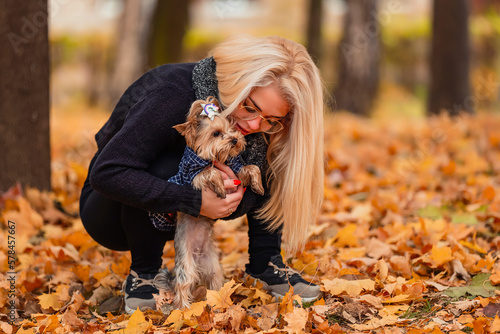 girl with her little dog in autumn park © zokov_111