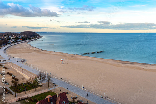 Fototapeta Naklejka Na Ścianę i Meble -  The promenade of Travemünde beach. Travemünde has been a seaside resort since 1802, and is Germany's largest ferry port on the Baltic Sea
