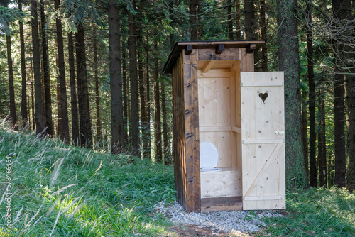 Bilde på lerret New open wooden outdoor toilet, outhouse in forest in beskid mountains