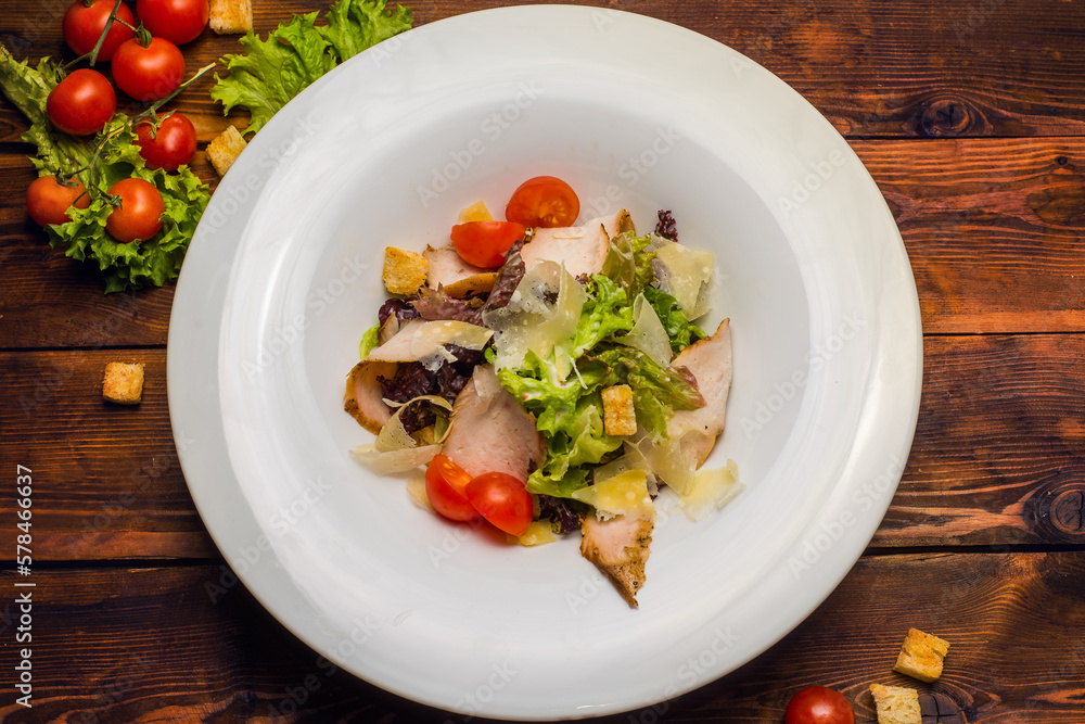 Salad with salmon and vegetables in a white plate Salad with salmon and vegetables in a white plate