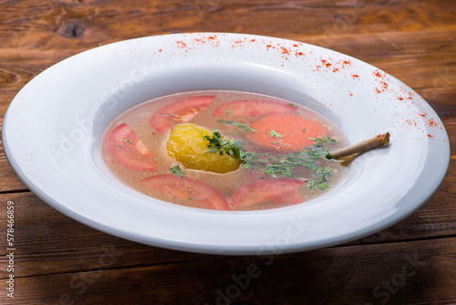 Broth with vegetables and meat photo