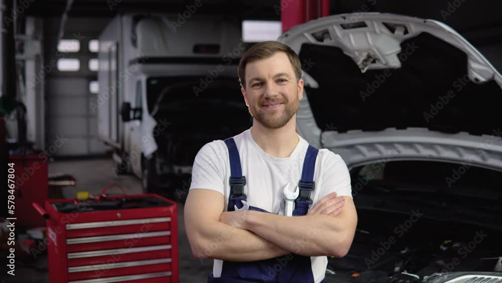 Car mechanic in garage with tools Car mechanic in garage with tools