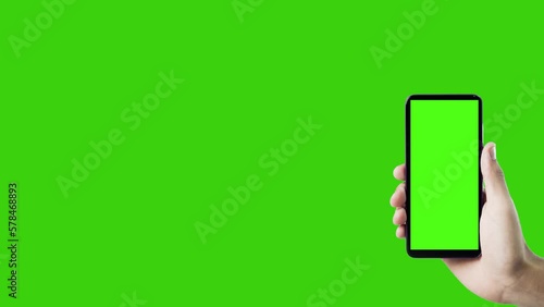 Hand holding smartphone with green screen. Mobile phone with chroma key. smartphone concept. app concept.