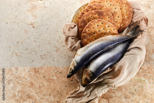 Catholic still life of five loaves of bread and two fish photo