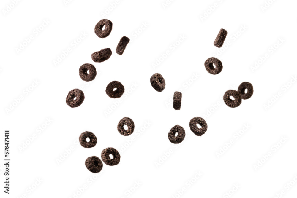 Chocolate rings cereal spill out into a bowl. Breakfast.