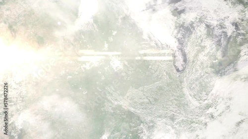 Earth zoom in from outer space to city. Zooming on Ames, Iowa, USA. The animation continues by zoom out through clouds and atmosphere into space. Images from NASA
