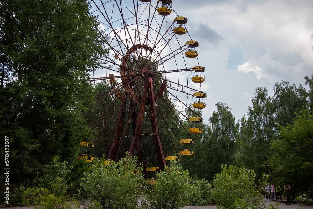 Old ferris wheel in the ghost town of Pripyat. Consequences of the accident at the Chernobyl nuclear power plant. Chernobyl zone. Nuclear danger. Ghost City Prypiat. Lost place. Ukraine. CCCP.