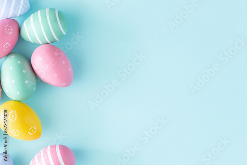 Flat lay easter egg concept pastel blue background with copy space top view