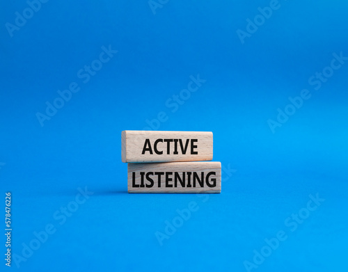 Active listening symbol. Wooden blocks with words Active listening. Beautiful blue background. Business and Active listening concept. Copy space.