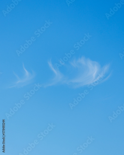 blue sky with white feathery clouds. photo of nature with view of bright sky. beauty of natural colors. relaxation meditation and contemplation  zen self-love